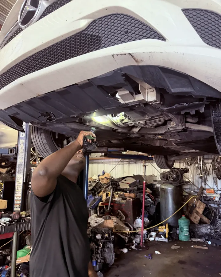 Underbody inspection on the lift at Front Line Auto