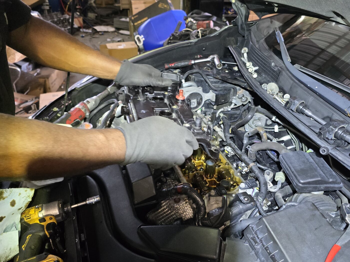 Front Line Auto technician performing engine repair work in Oakland Park