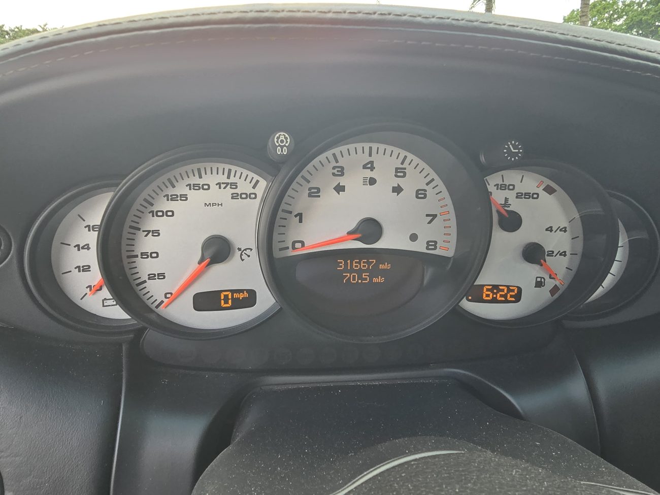 Instrument cluster with the odometer and warning lights visible at Front Line Auto