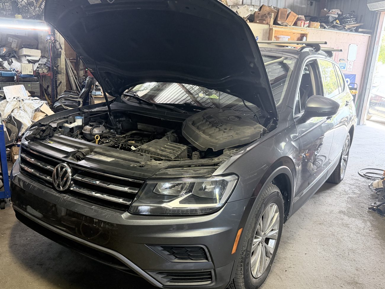 Everyday car with the hood open for engine and electrical diagnosis at Front Line Auto in Oakland Park